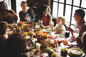 A large family gathered around a feast table