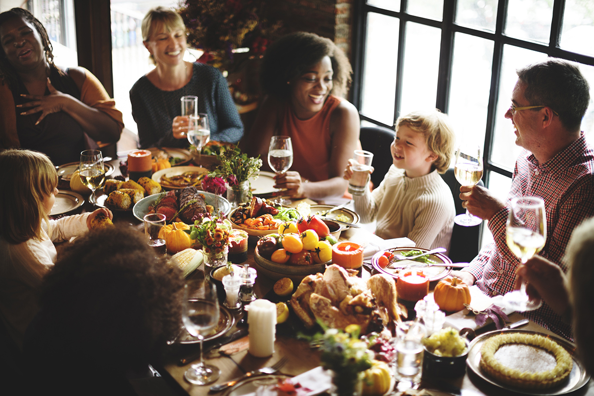 A large family gathered around a feast table