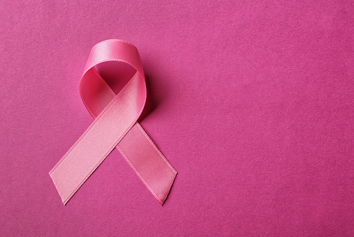 Pink ribbon for breast cancer on a pink background