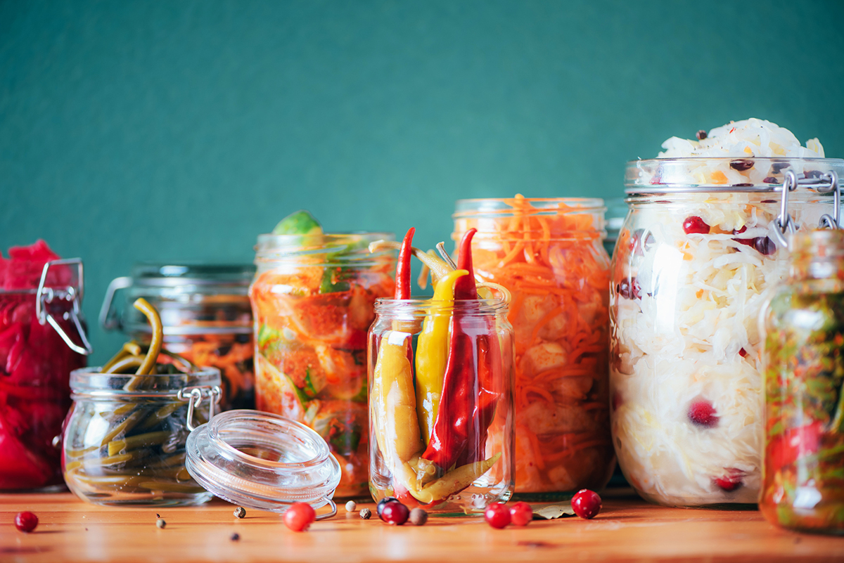 Many jars of probiotic rich foods such as sauerkraut, kimchi, pickles, etc.