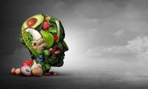 Head made of various produce, on a cloudy background