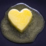 butter heart melting on dark backgroun