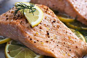 Baked Salmon on a bed of lemon slices.