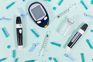 Diabetes treatment equipment with blood glucose sugar meter, lancets, insulin vial and syringes