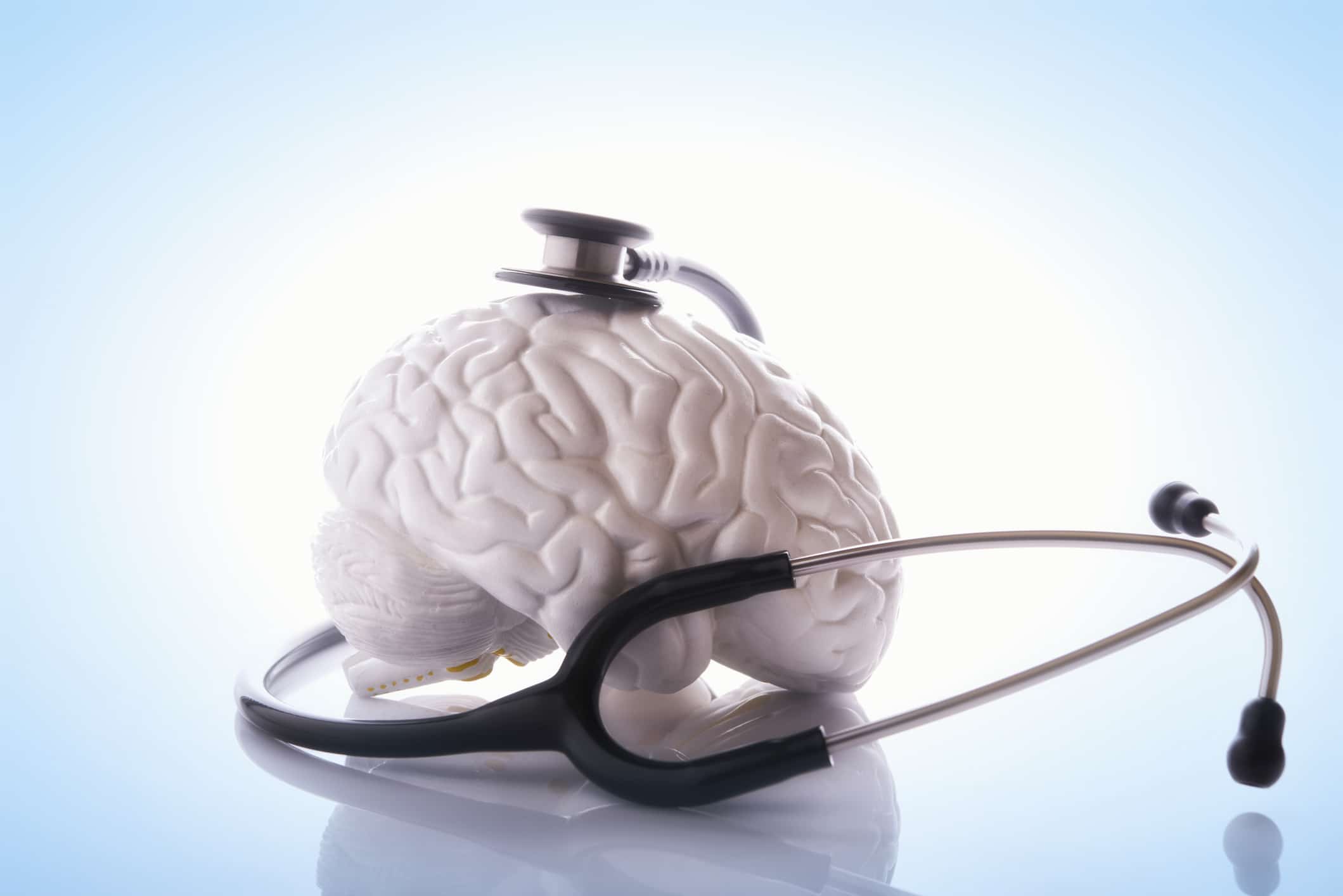 Stethoscope surrounding a model brain