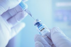Medical worker preparing influenza vaccine for vaccination